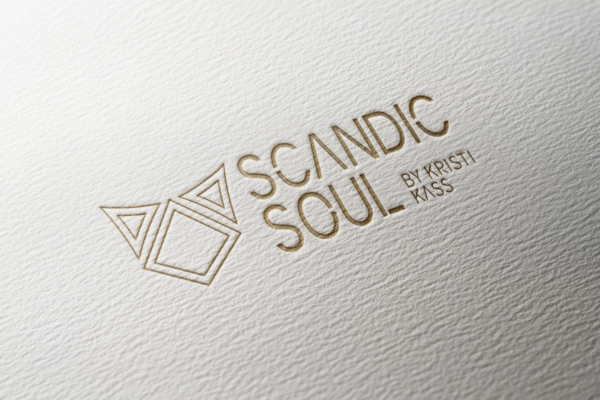 golden logo on a paper mockup to show how it looks